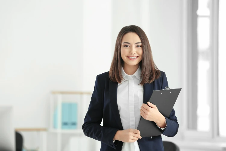 Car-Accident-Claims-How-Much-Do-Lawyers-Generally-Charge a woman holding a clipboard costing car accident claims