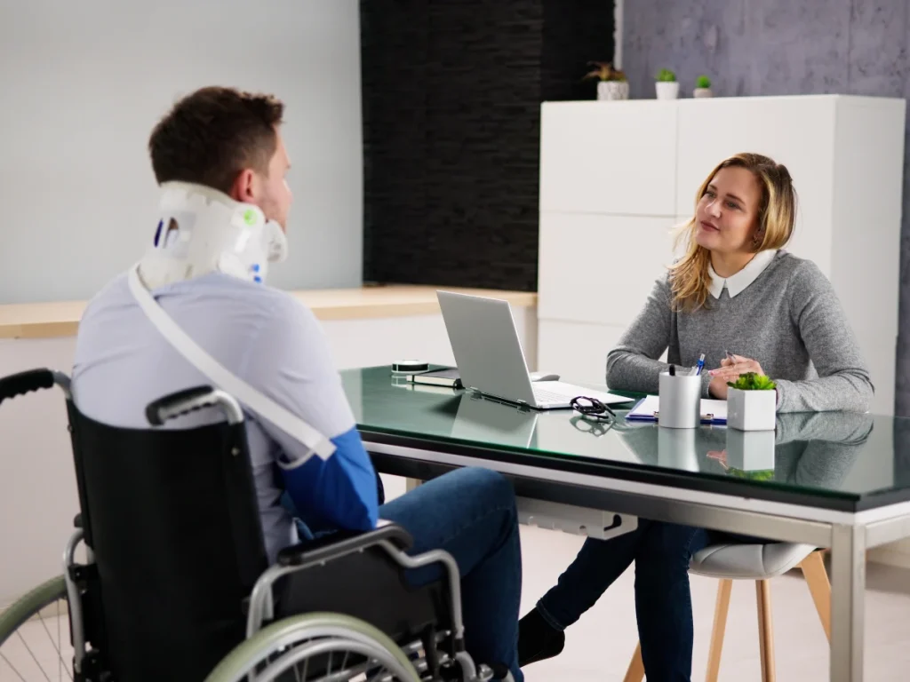 The Role of a Personal Injury Law Attorney in Seeking Justice for Victims 1 a personal injury law attorney woman in a wheelchair talking to a man in a wheelchair