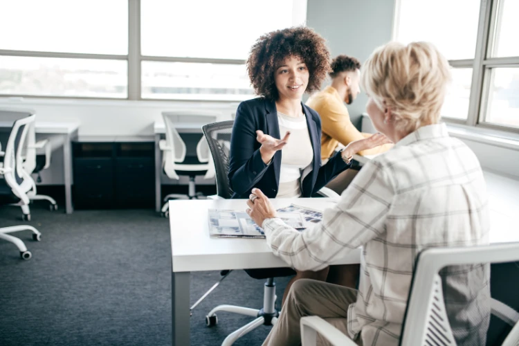 10 Tips for Hiring an Offshore Accident Attorney 1 a woman talking to an offshore accident attorney at a table