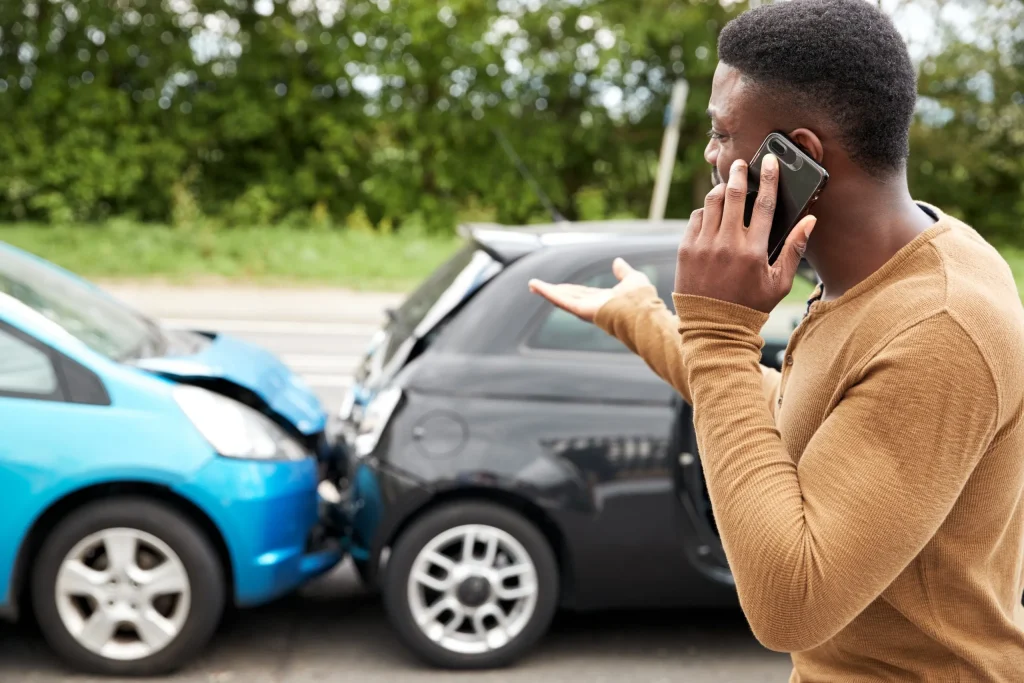 How a Car Accident Attorney Can Help Maximize Your Compensation 1 Car accident victim speaking with a car accident attorney after a crash.