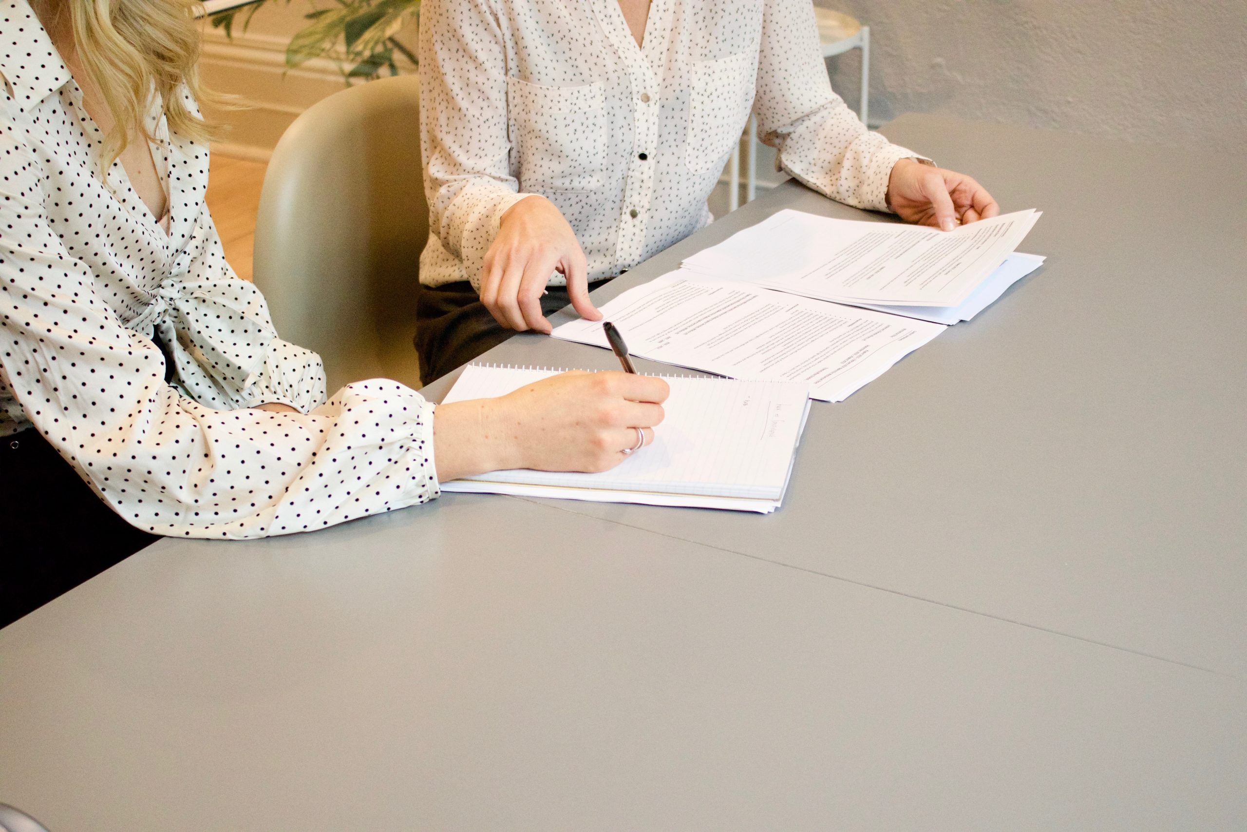 Pedestrian Accident Attorneys: How to Choose the Right Lawyer to Represent You 3 Pedestrian Accident Attorneys discussing documents at table